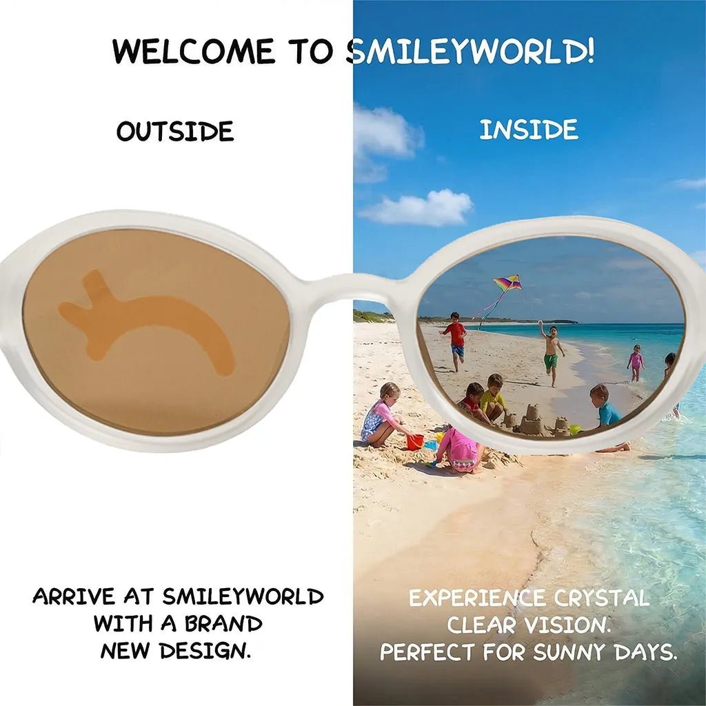 Comparison view of SmileyWorld snow white oval kids sunglasses demonstrating seamless lens printing technology. The left 'outside' view shows a closed happy eyes design on the lens, while the right 'inside' view reveals crystal clear vision of children playing on a sunny beach.
